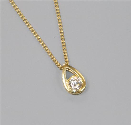 A modern 18ct gold and solitaire diamond pendant, on an 18ct fine link chain, pendant 10mm.